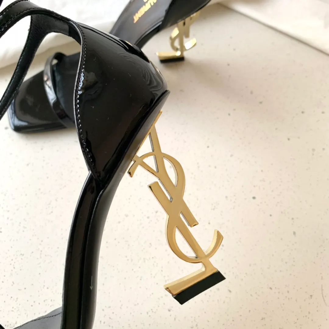 👟👟Ex-factory price 520👟👟 SAINT LAUREN*" Saint Laurent YSL classic one-word high-heeled sandals with logo lettering. Only YSL understands women's hearts best and does not accept refutation. It is a super invincible feminine artifact and a must-have for women (✅Z product full body customization, own molded toe hardware, perfect consistency) Upper: Customized imported cotton silk fabric/imported calf patent leather Inner lining: imported 🐑 sheepskin Sole: imported genuine leather outsole Heel height: 9cm Color: black lacquer with silver, black with gold Size: 35-39 (full set of packaging)